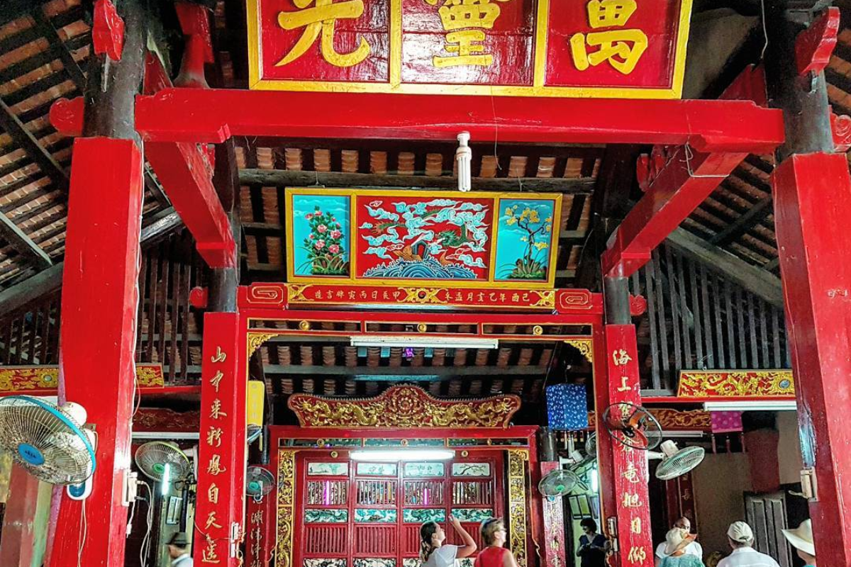 Interior of Van Thuy Tu Temple with whale god statue and traditional wooden altars
